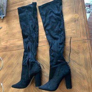 Black thigh high suede boots. Never worn.